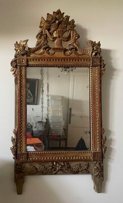 a mirror hanging on the wall in a room