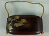an image of a wooden purse with gold flowers on it