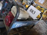 a picture of a small machine in a garage