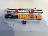 a model of a train on display on a white surface