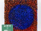 an image of a knitted square with a credit card