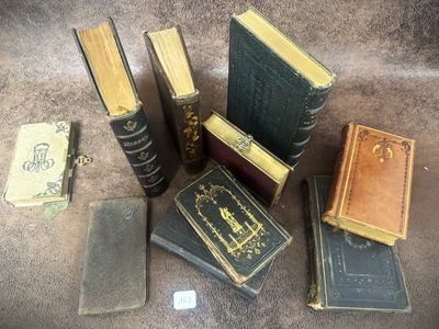 many books that are sitting on a table together