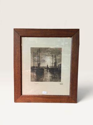 an old picture of a ship in a wooden frame on a white background