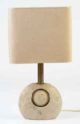 concrete table lamp with a beige shade on a white background