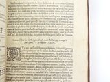 an open book with music notes on it on a white surface
