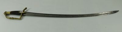 a small sword that is on display on a table