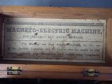 an old wooden box that has a sign on it