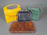 three purses that are sitting on a table