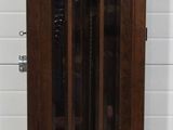 a grandfather clock that is in the corner of a room
