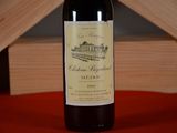 a bottle of wine that is sitting on a table