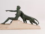 statue of a man and a dog on a marble base