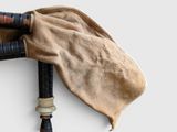 a bagpipe with a cloth on top of it
