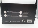 the back of a black box with a picture of a clock on it