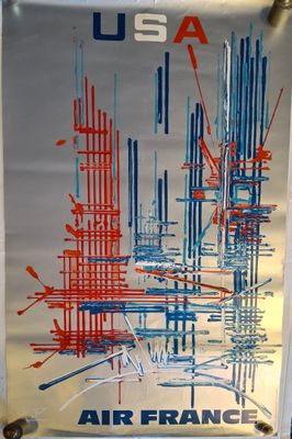 une photo d'une affiche d'Air France accrochée à un mur