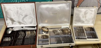 a lot of silverware in a case on a table