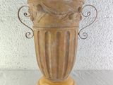 a large vase with a horse on it on a table