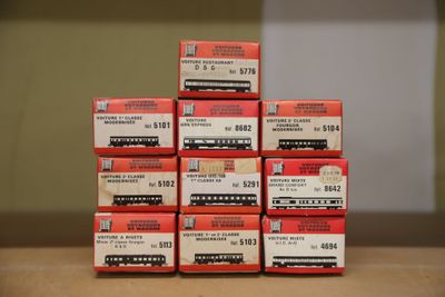 a stack of red boxes sitting on top of a table