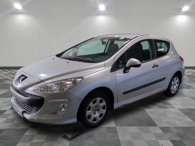 a picture of a silver car parked in a garage