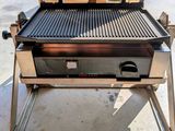 a grill that has a grill on top of it
