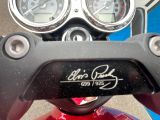 a close up of a motorcycle with a speedometer and gauges on it
