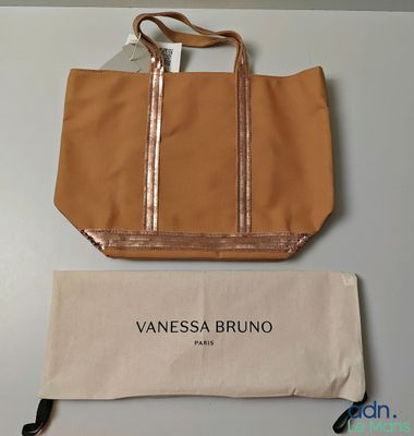 an image of a tan bag and a tan bag on a table