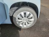 a close up of a tire on a blue car