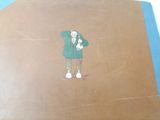 a drawing of a person on the back of a suitcase
