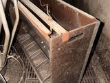 a dirty stove with a metal shelf and a metal grate