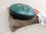 a green disk sitting on top of a brown bag
