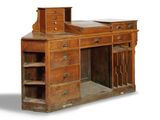 an old wooden desk with drawers and shelves on it