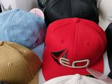 a lot of hats that are sitting together on a table