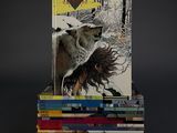 books stacked on top of each other on a black surface