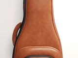 the guitar case is brown and has a gold logo on it