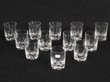 a lot of glasses that are sitting on a table