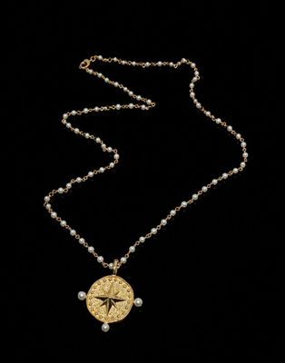 a close up of a necklace on a black background