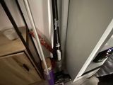 a mop that is sitting on the floor next to a vacuum