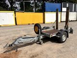 a trailer with a trailer attached to it in a parking lot