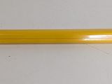 yellow metal shelf mounted to a wall with a white background