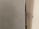 a white refrigerator with a door open in a kitchen