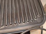 a grill with a grilling pan on top of it