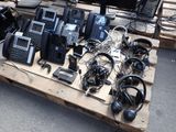 a lot of electronics on a pallet on the street