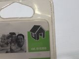 a plastic package with a picture of a couple and a house on it