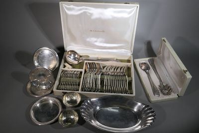 a lot of silverware in a box on a table