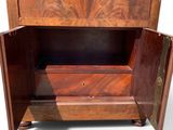 a wooden cabinet with a door open on a white background