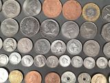 a lot of coins that are on the table