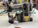 a sewing machine that is sitting on a table