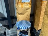 two stools sitting next to each other on the street