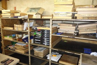 a room filled with lots of boxes and shelves