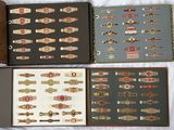 several different types of cigars are lined up on a white sheet