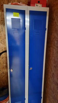 two blue lockers next to each other in a room
